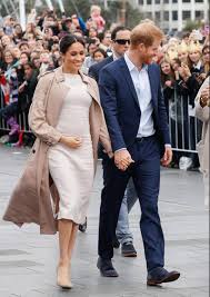 Harry is sitting on the ground with meghan laying her head on his lap. Pregnant Meghan Markle Has Done A Swell Job With Prince Harry On Their Royal Tour Now It S Time For Her To Put Her Feet Up
