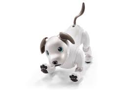Black And White Robot Dog Sony Uses Artificial Intelligence To Bring Aibo Robot Dog Back To Life Robot Sony Wearable Technology