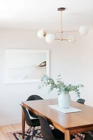 Multiple Globe Pendant Light Over Modern Dining Table With Black Mid Century Modern Chairs Dining Room Pendant Lights Over Dining Table Mid Century Dining Room