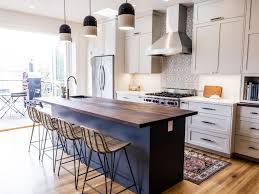 Dark counters—whether glossy or matte—will make your dishes shine and vibrant flowers and linens pop. 20 Polished Kitchens With Striking Black Kitchen Islands Dark Kitchen Island Trend