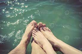 A couple in love wetting their feet in the sea. Summer holidays. Vintage.  8507270 Stock Photo at Vecteezy