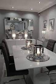 Dark charcoal grey makes a sophisticated backdrop, brought to life with gold accents such as upholstery, frames, furniture and a statement clock. Home Sweet Home Dining Room Table Decor Elegant Dining Room Living Room Decor Apartment