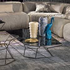 Stacked glass panels float within a plated metal frame, offering display storage in a smoky finish. Contemporary Coffee Table Rebus Arketipo Glass Metal By Mauro Lipparini