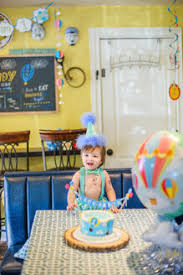 Save 5% with coupon (some sizes/colors) Baby Boy Wearing Party Hat Smashing First Birthday Cake At Table Stockphoto