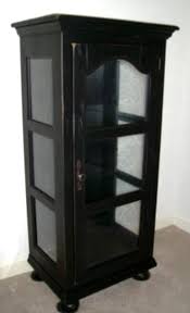 Beautiful curio cabinet featuring design work on the glass doors and glass side panels with 2 doors beautiful white rubbed finish adorns this 2 door/2 drawer cabinet with 2 glass shelves that will hold up. Broyhill Attic Heirlooms In Curio Cabinet In Black Stain Broyhill Tall Cabinet Storage Furniture Collection