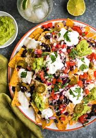 Fully Loaded Vegetarian Nachos With Homemade Guacamole Fresh Salsa Black Beans And Jalapenos Vegetarian Nachos Vegetarian Recipes Mexican Food Recipes