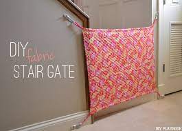 How To Make A Diy Baby Gate Using Fabric The Diy Playbook Diy Baby Gate Fabric Baby Gates Diy Baby Stuff