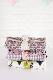 Begin to knot the pieces of fabric. Simple Yarn Tied Baby Blankets See Kate Sew