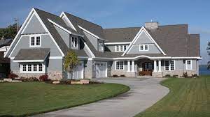 To create this big house in a small package, we drew upon the cape cod tradition with a series of volumes stepping back along the edge of the coastal bank. Two Story Cape Cod House Plan