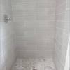 One piece fiberglass construction with two built in shelves. 1