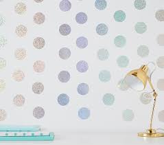 Removable wall decals—like these golden stars—are magic on a wall behind your holiday table, your tree, in your entryway. Wallpops Holographic Confetti Dots Kids Wall Decals Pottery Barn Kids