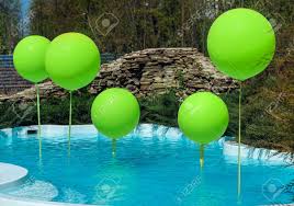 Weighted pool balloons for covers. Pool With Big Green Balloons Outdoor Poolside Party The Balloons On Water Decorations For Wedding Ceremony By The Pool With Blue Water Stock Photo Picture And Royalty Free Image Image 98780585