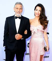 George clooney and his wife amal alamuddin get close after heading back to lake como in italy, ten months after they wed in lavish venetian ceremony. George Clooney Introduced Himself As Amal Clooney S Husband At An Event Yesterday