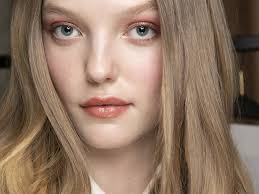 Layers of light brown hair on the darker background. Dark Blonde Is The Low Maintenance Hair Color Trend Coming In 2019 Allure