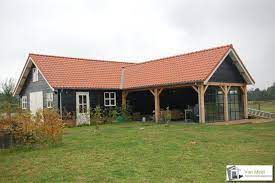 van meel timmerwerken specialist in luxe eikenhouten bijgebouwen huis buitenkant woningbouw pergola patio
