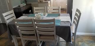 Skempton Dining Table And Chairs Set Of 7 Ashley Furniture Homestore In 2020 Dining Room Table Set Dining Table Chairs Table And Chair Sets