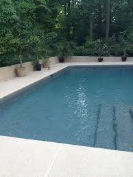 A predominantly grey finish intermixed with blue, green and burnt orange pebbles enhanced with shimmering sea offering a subtle spectrum of color on the water's. Tahoe Blue Pebble Tec Contemporary Swimming Pool Raleigh By Vue Custom Pools Houzz