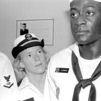 Midshipman 1ST Class Jeri Smalley inspects the uniform of Midshipman  Candidate Gary Sussman during the first day of his indoctrination period at  the Naval Academy Preparatory School