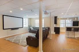 Home theater seating is available in virtually every color, pattern, and fabric, and can easily accommodate any aesthetic. Total Basement Finishing A Blackdog Affiliate Basement Finishing Photo Album A Stunning Basement Bar And Home Theater In Littleton Ma