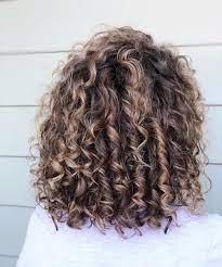 Ash brown hair has a reputation for being elegant and stylish. 21 Stunning Examples Of Caramel Balayage Highlights For 2021 Colored Curly Hair Highlights Curly Hair Dyed Curly Hair