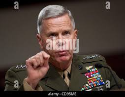 The Assistant Commandant of the Marine Corps Gen. Glenn M. Walters, left,  shakes hands with U.S. Marine Corps 1st Lt. Ruth L. Fish, S-4 officer,  Combat Logistics Battalion 3 (CLB-3), Headquarters and