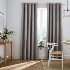 Draw this single blackout curtain panel across your window before you go to bed to prevent morning sunlight from disturbing your sleep. Ready Made Curtains Online Eyelet Pleated Blackout Closs Hamblin