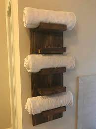 Store garbage bags on a paper towel holder. Handmade Reclaimed Wood Towel Rack Shelf The Piece Features Five Shelves To Neatly Store Your Bathroom Wood Shelves Reclaimed Wood Towel Rack Wood Towel Rack
