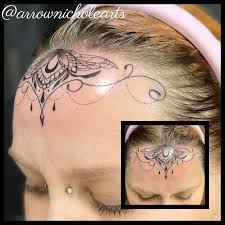 Image result for quirky pylon forehead tattoo