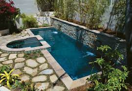 Sometimes the joint wall between the pool and spa is left uncapped to create a more cohesive look, as seen in this pool and spa combo (at right). Top 8 Swimming Pool Shapes Luxury Pools Outdoor Living