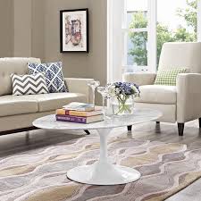 A timeless modern classic in continuous production since 1956. Saarinen Style Tulip 48 Oval Marble Coffee Table Emfurn
