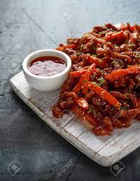 Pour away all but 1 tbsp oil. Crispy Shredded Beef With Carrots And Sweet Chilli Sauce On White Wooden Board Chinese Takeaway Food Stock Photo Picture And Royalty Free Image Image 119397478