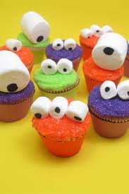 You can draw the cookie inside of the mouth a brown color. Mini Monster Cupcakes For An Easy Halloween Treat Idea The Decorated Cookie