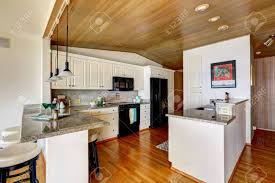 paneled ceiling, white cabinets