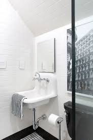This kids' bathroom by amy morris is proof that black and white—and stripes—will never go out of style. Boys Vs Girls Kids Bathroom Reveal The Makerista Girl Bathrooms Girls Bathroom Boy Girl Bathroom