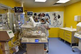Newborn baby boy floating on a swim ring. Mali Woman Gives Rare Birth To 9 Babies