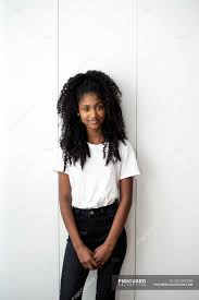 Blonde and black hairstyle for dark complexion girls. Portrait Of Young Black Teenage Girl Looking Into Camera In A White Background Indoors Skin Stock Photo 251670790