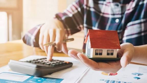 Homeowner reviewing amortization schedules after refinance