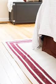 Carpet remnants can be purchased from carpet stores at greatly reduced prices, or you can use carpeting that you have pulled from your own home or from a friend's home too. Diy Rug From A Canvas Drop Cloth The Handyman S Daughter