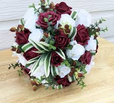 Finding the right flowers to accompany the silk bridal bouquet is one of our specialties. Burgundy Bridal Bouquet Rosie Silk Flowers