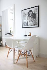 A small kitchen table and chairs in a bright metallic shade can really liven up a room. Small White Dining Table By Ikea And Eames Chairs Love The Print No Source Unfortunately Dining Room Small Small Dining Room Table Small Dining Table