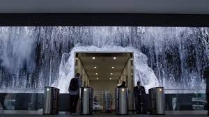 Transforming What Was Once A Sterile Lobby Of Travertine Limestone And Glass A 100 Foot Long Led Screen Was Installed To In 2020 Lobby Salesforce Communication Art