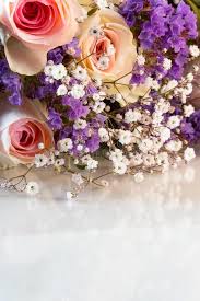 An arrangement of elegant white roses remains an classic favorite. Close Up Of Bouquet Of Pink Roses Mixed With Small Purple And White Flowers Stock Image Image Of Bridal Decoration 120354673