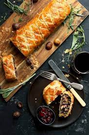 A Rich And Tasty Mushroom Wellington With Chestnuts Spinach Caramelized Onions Vegetarian Christmas Recipes Vegetarian Christmas Dinner Christmas Food Dinner