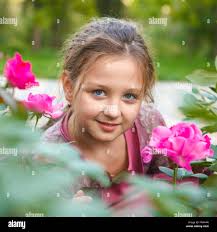 Girl rose bush hi-res stock photography and images
