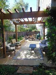 Small trendy backyard stone patio container garden photo in new york with no cover i like the pavers simply think of your small backyard patio as a more intimate space, ideal. Patio Designs For Small Spaces Small Outdoor Patios Backyard Patio Outdoor Patio Designs