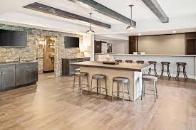 The basement renovation of homestead farm is a modern wet bar paired with a modern, cozy living room. Luxurious Urban Farmhouse In Ohio Offers Delightful Entertaining Spaces