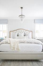 I love the idea of reversible bedding, with a little bit navy blue and gray area rugs. Light Blue Gray Bedroom With Chandelier Over Bed Transitional Bedroom