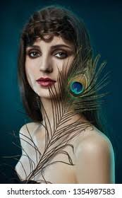 5+ Thousand Girl Peacock Feather Royalty-Free Images, Stock Photos &  Pictures