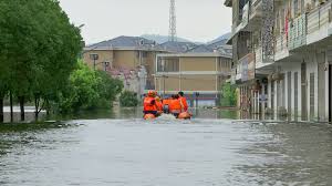 China's xinhua news agency reported that a dozen people were killed in the catastrophic flooding and more than 100,000 people have been forced to flee to safe ground. Firemen Ensure Small Town S Safety Amid E China Flooding Cgtn