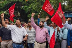 Indian workers go on a daylong nationwide strike against Modi's economic reforms | AP News